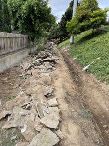 demo of failed v-ditch - there was no wire mesh reinforcement.