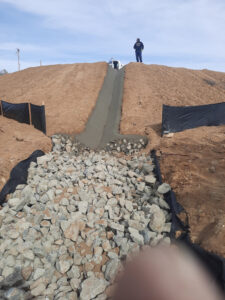 vditch into rock riprap pad to slow the velocity of the water